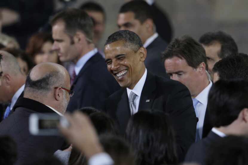 President Barack Obama greeted audience members after speaking at the Anthropology Museum in...