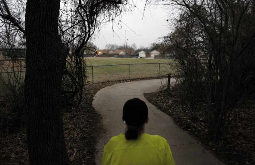 Lisa Taylor walks around her Flower Mound neighborhood for an exercising early morning on...