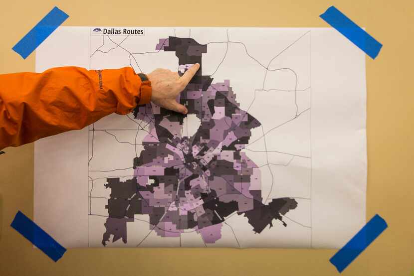 Volunteers check routes on a map at Wilshire Baptist Church before setting out for the 2017...