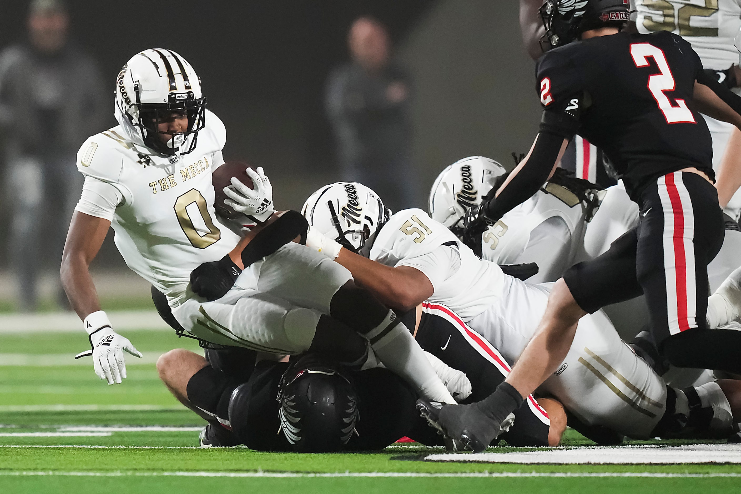 South Oak Cliff running back Jayvon Thomas (0)  is brought down by Argyle defensive back...