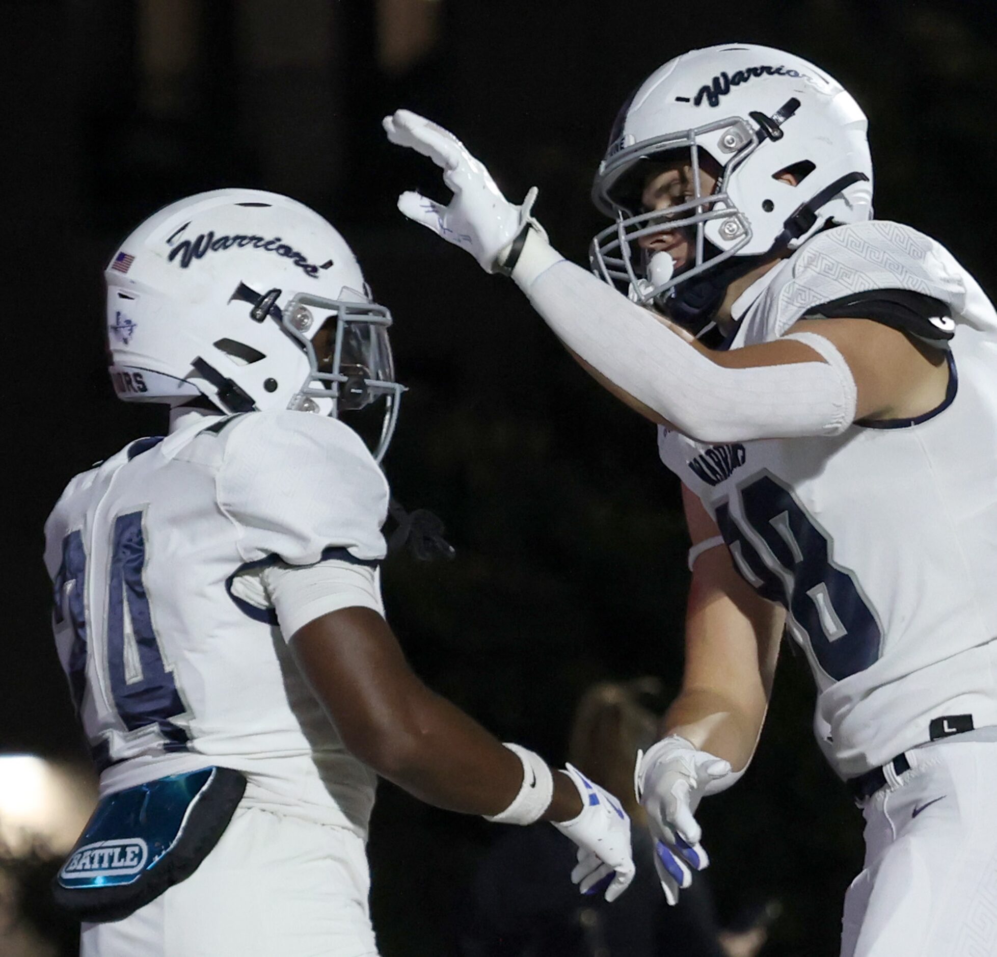 Argyle Liberty Christian running back Quentin Brown (24), left, receives congratulations...