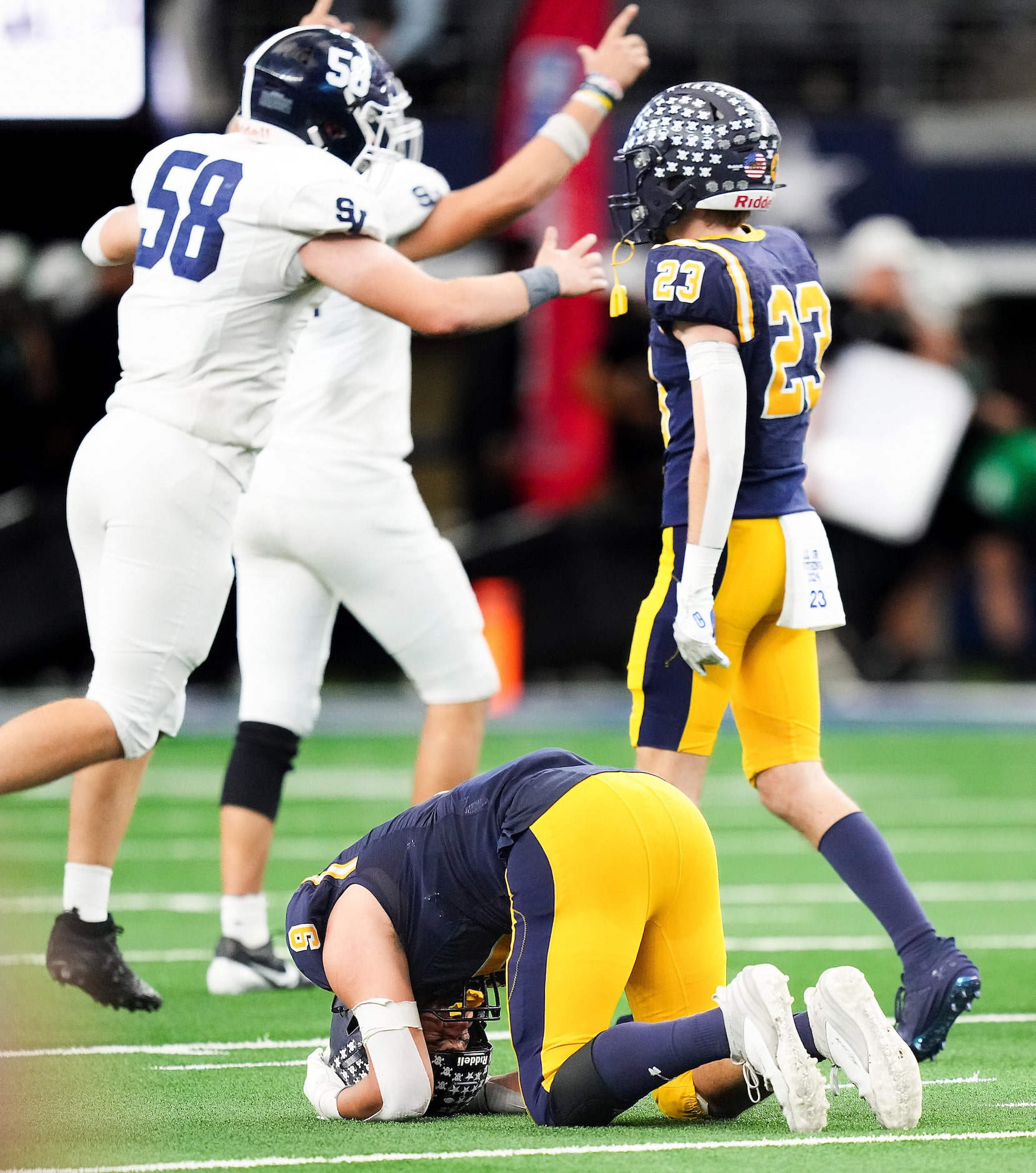 Highland Park's Jack Morse (9) collapses to the turf as Smithson Valley players celebrate as...