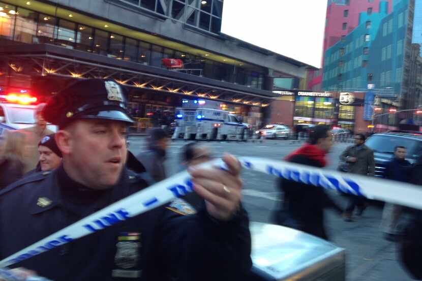 Police respond to a report of an explosion near Times Square on Monday in New York.