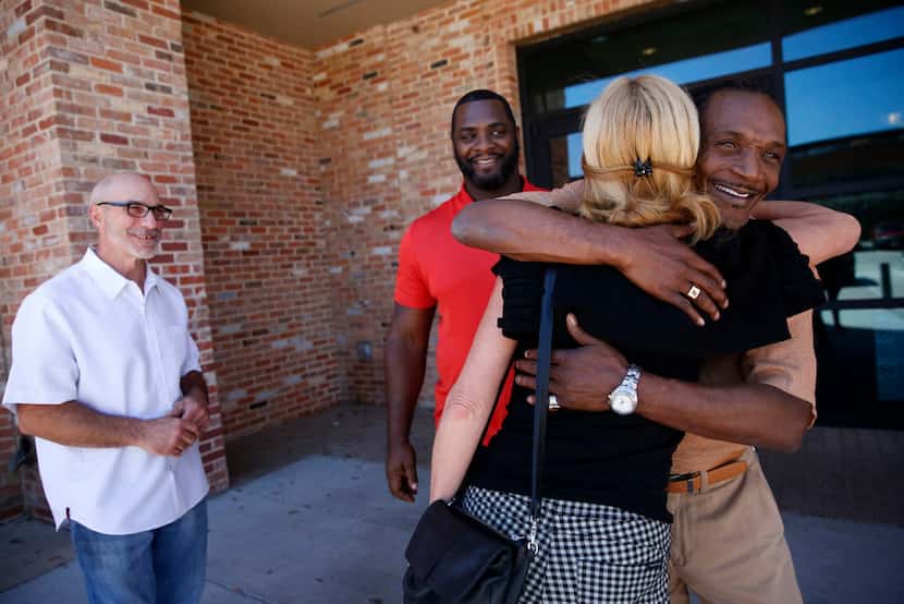 Exoneree Johnnie Lindsey hugs Dorothy Budd, author of Tested: How Twelve Wrongly Imprisoned...