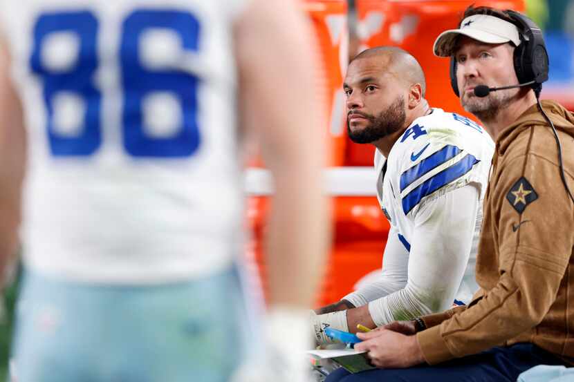 Dallas Cowboys quarterback Dak Prescott (4) watches from the bench with offensive...