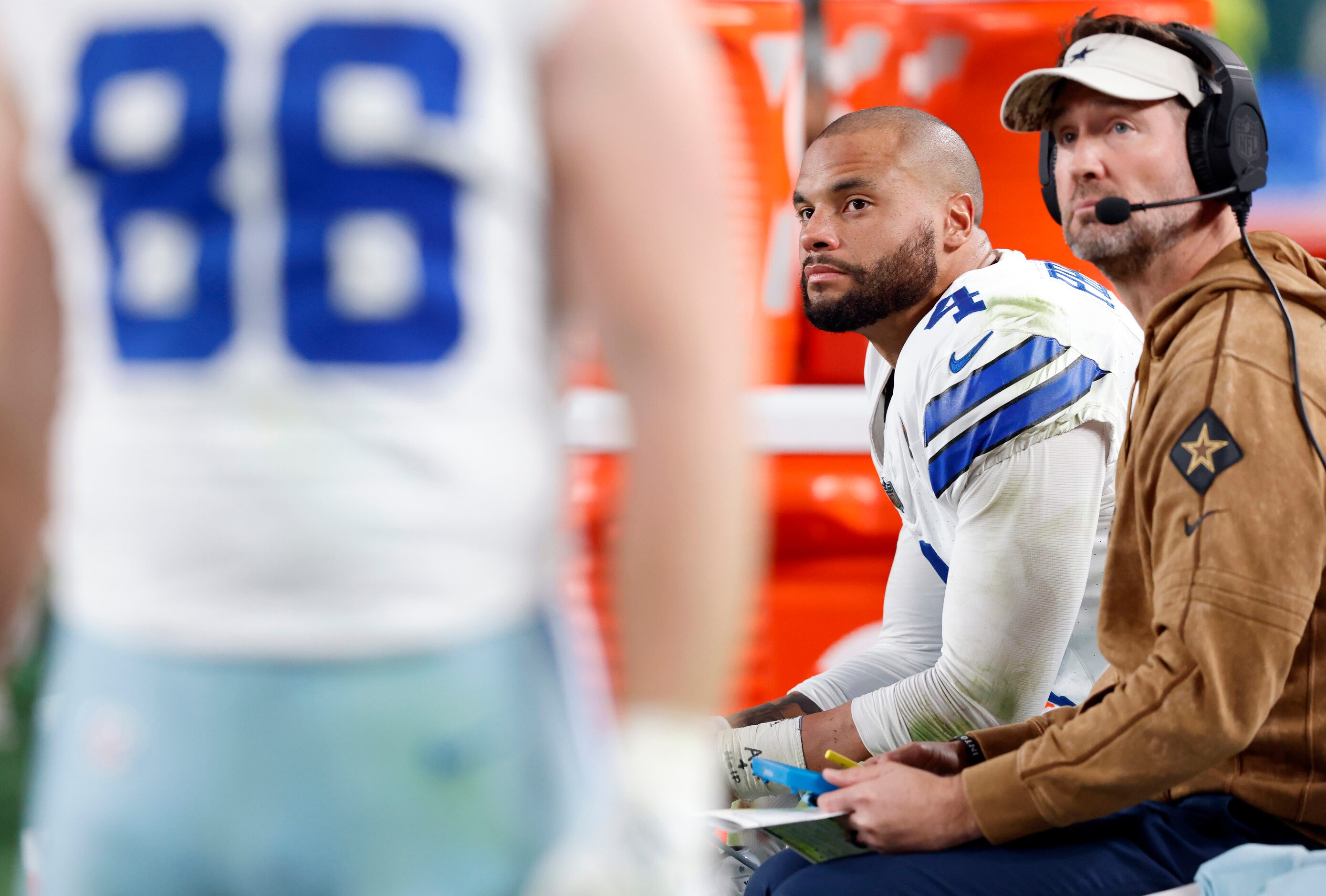 Dallas Cowboys quarterback Dak Prescott (4) watches from the bench with offensive...