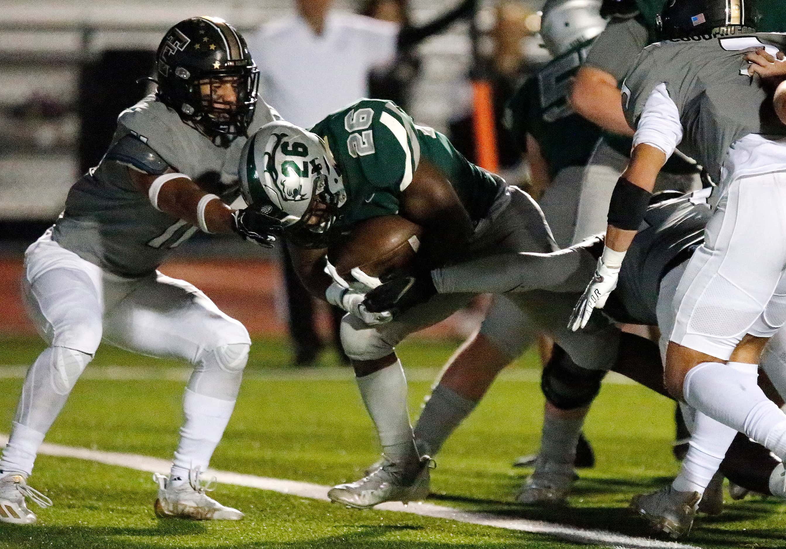Frisco Reedy High School running back Aaron Daniels (26) crosses the goal line for a...