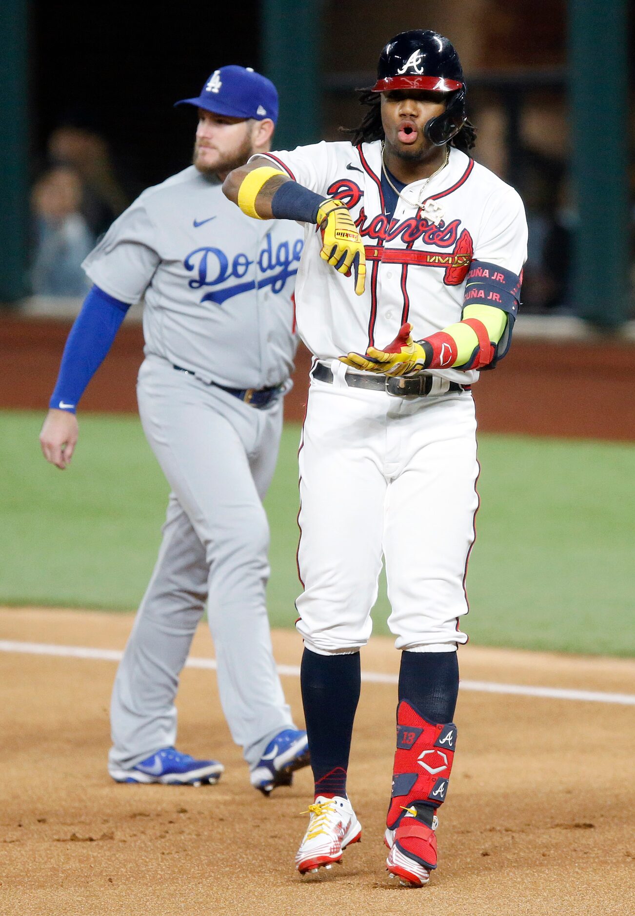 Atlanta Braves Ronald Acuna Jr. celebrates his lead off single against Los Angeles Dodgers...