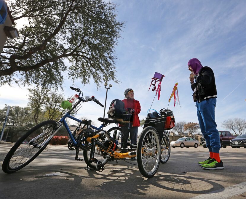 The Weisses make a stop at the bank as they run errands by bicycle near their home. (Louis...