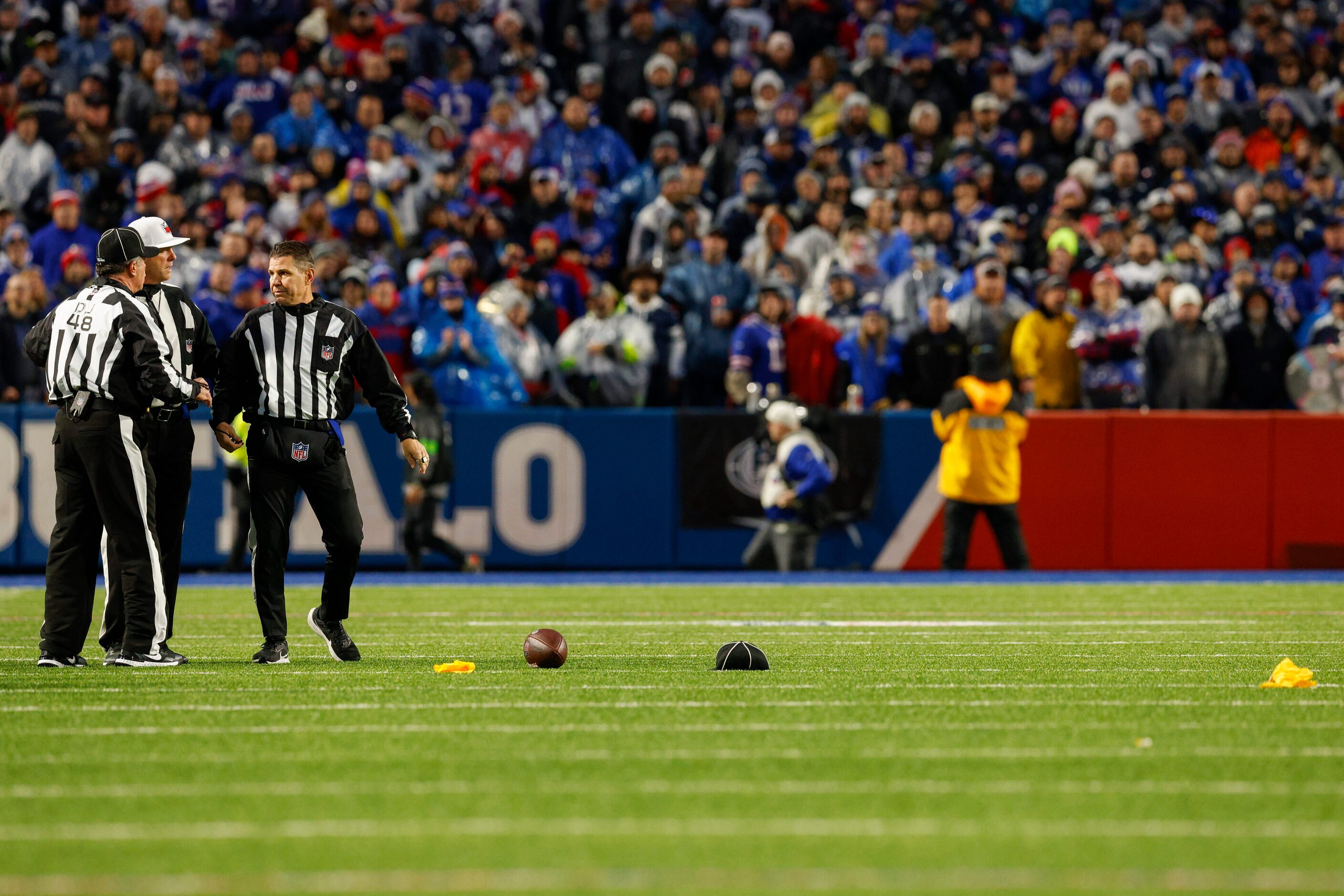 Officials talk after multiple flags and hats were thrown after Dallas Cowboys quarterback...