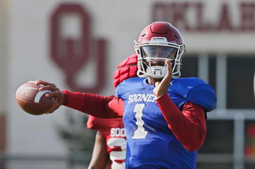 Oklahoma quarterback Jalen Hurts throws during an NCAA college football practice in Norman,...