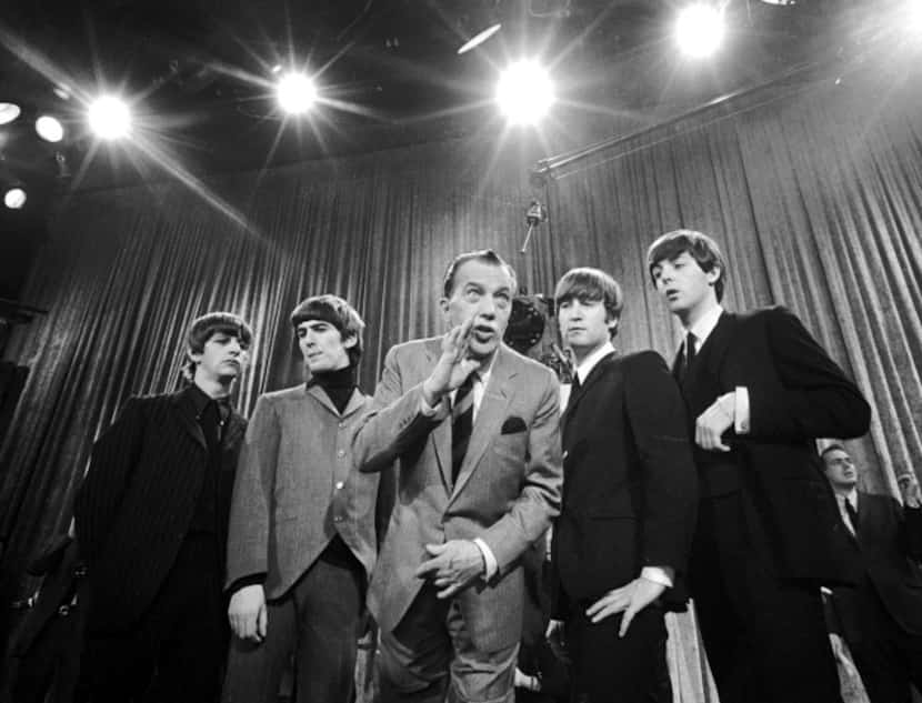 Ed Sullivan, center, stands with The Beatles, from left, Ringo Starr, George Harrison, John...