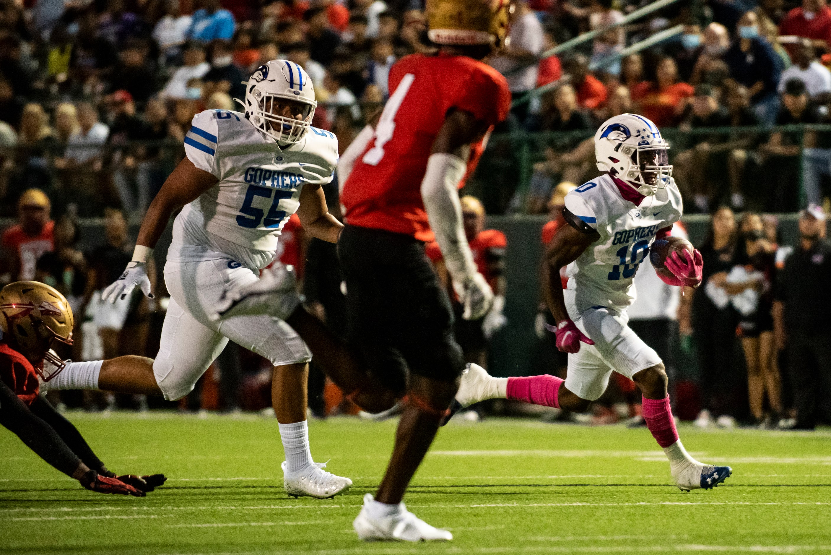 Grand Prairie senior Drew Damper (10) sprints down the side of the field to score during...