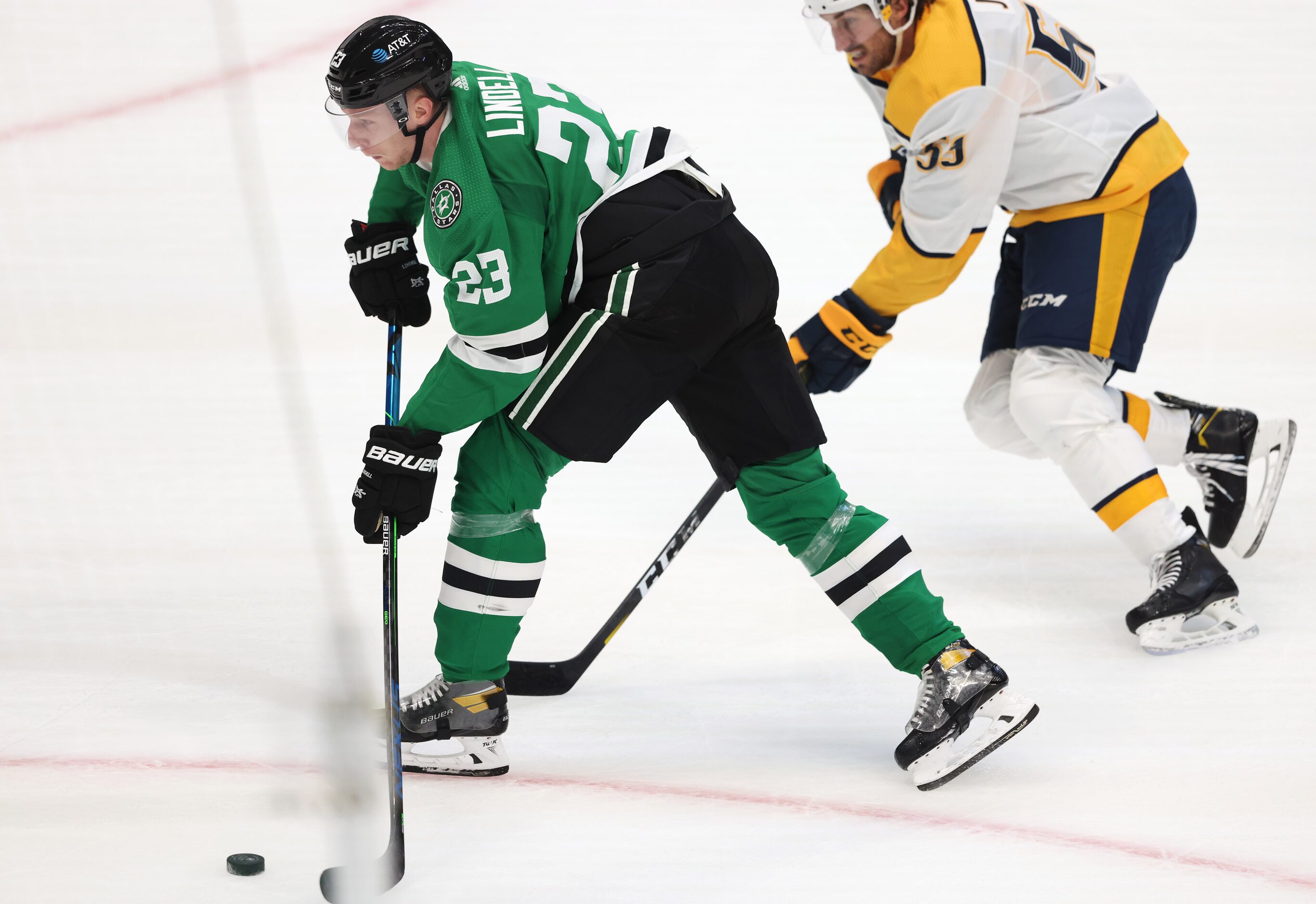 Dallas Stars defenseman Esa Lindell (23) shoots and scores a goal as Nashville Predators...