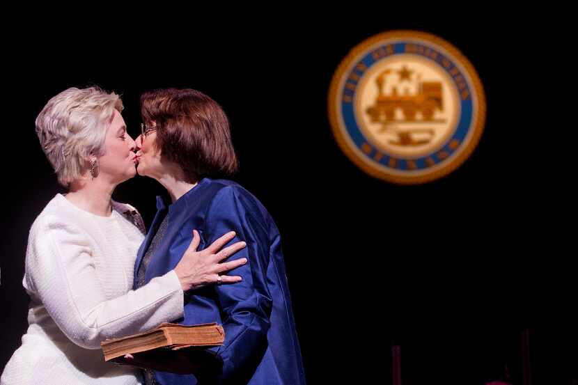 Houston Mayor Annise Parker (left) kissed her partner, Kathy Hubbard, after Parker was sworn...