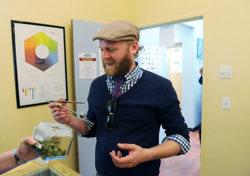David Temple, of Dallas, reacts to the smell of a variety of marijuana at the Northern...