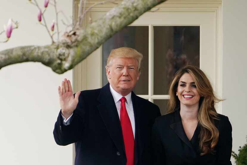 President Donald Trump poses with Hope Hicks shortly before making his way to board Marine...