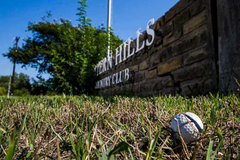 A broken golf ball lay near the entrance to Eastern Hills Country Club on Wednesday.