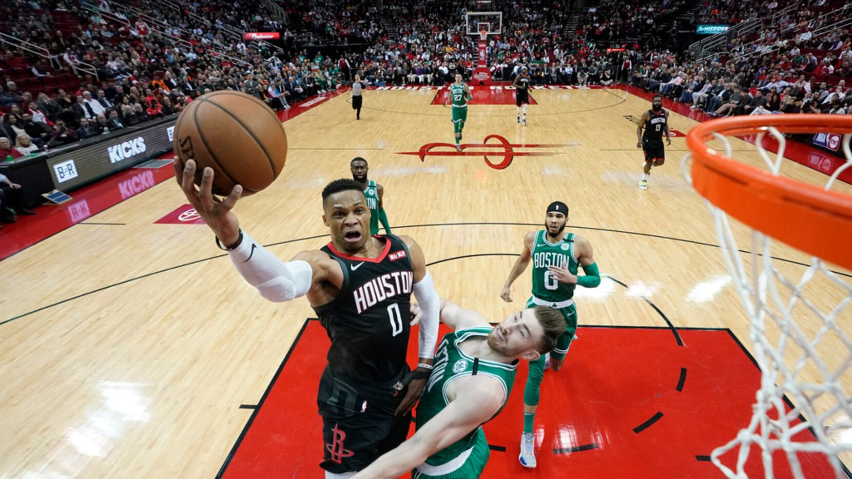 Houston Rockets' Russell Westbrook (0) goes up for a shot as Boston Celtics' Gordon Hayward...