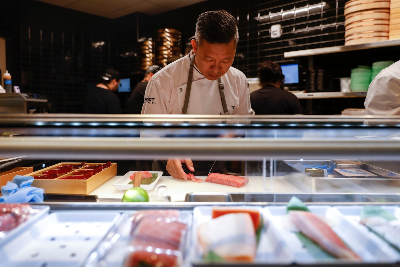 Tony Mai, corporate sushi chef of Komodo Dallas, works in the kitchen on Tuesday, March 28,...