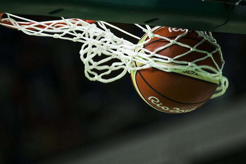 A free throw rips the net during a men's basketball game between the United States and the...