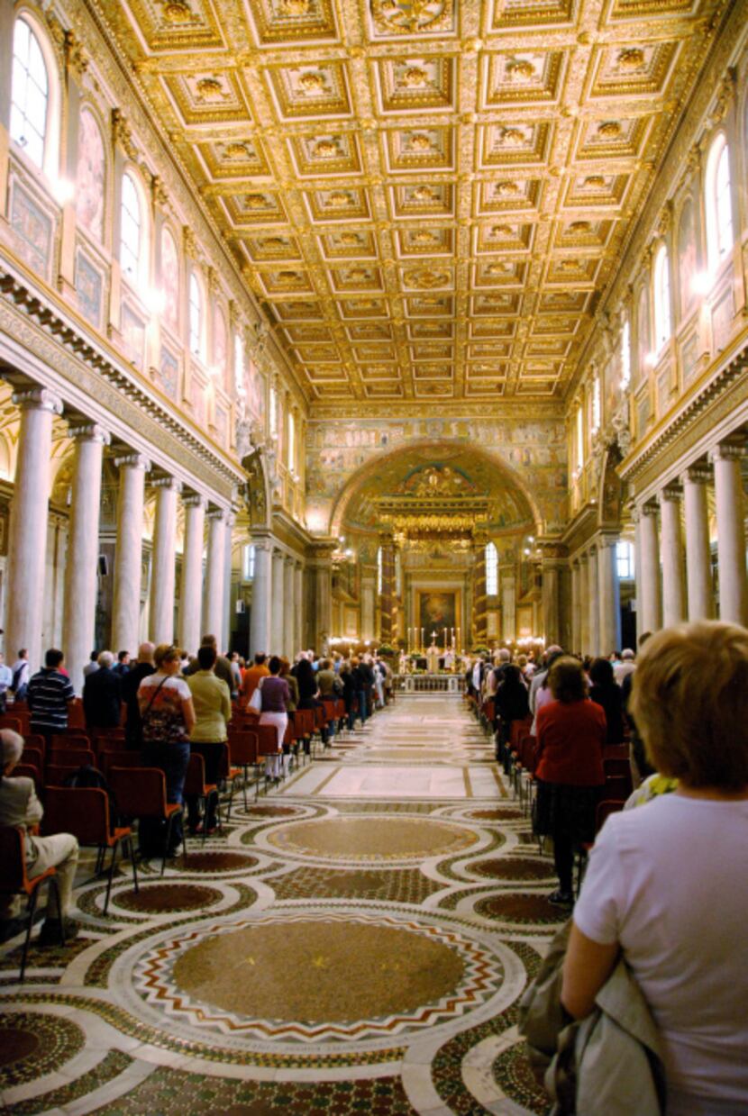 Regular worshippers and visitors alike attend mass at Santa Maria Maggiore, one of Rome's...