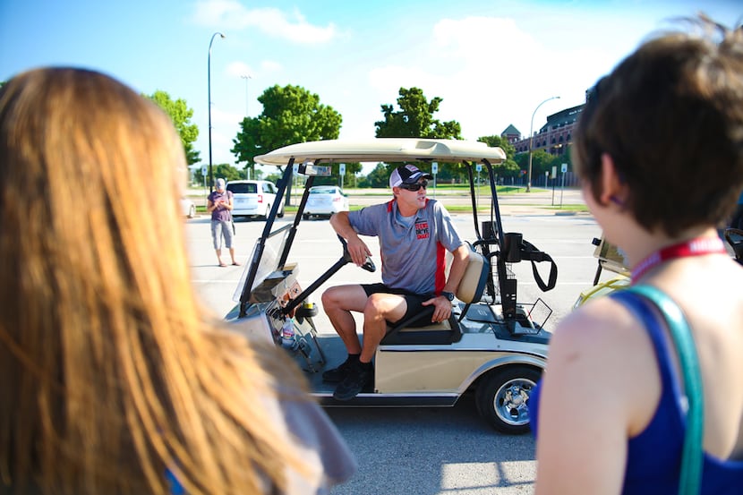 Instructor Andrew Shoen prepares drivers for the golf cart texting course, where they drove...