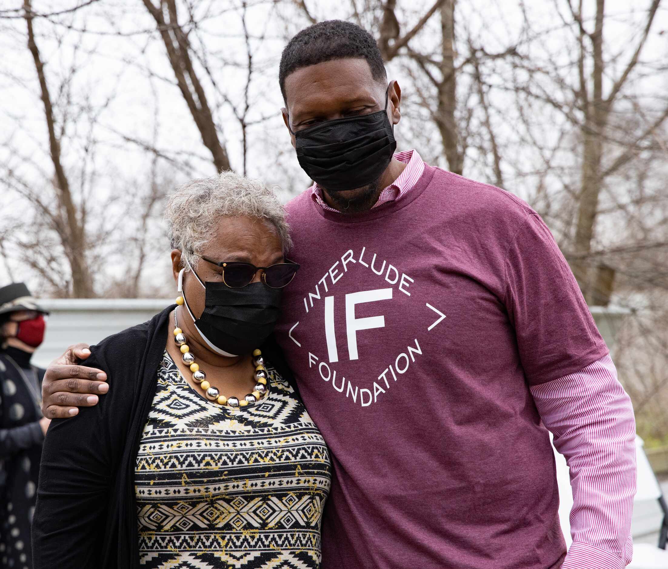 Quincy Roberts, the contractor who moved Shingle Mountain, hugs Marsha Jackson after a...