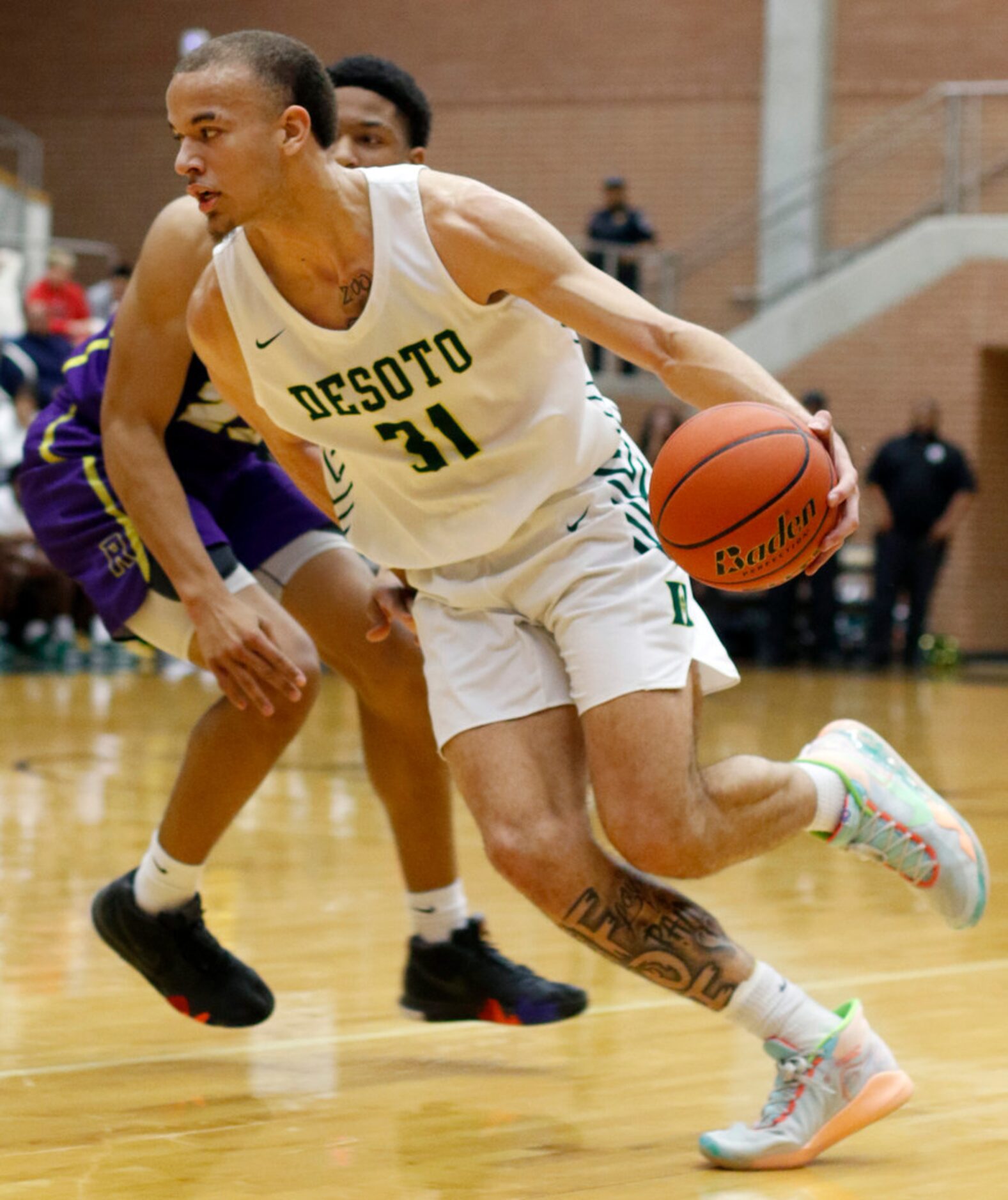 DeSoto's Duncan Powell (31) drives around the defense of Richardson's Derek Burns (23)...