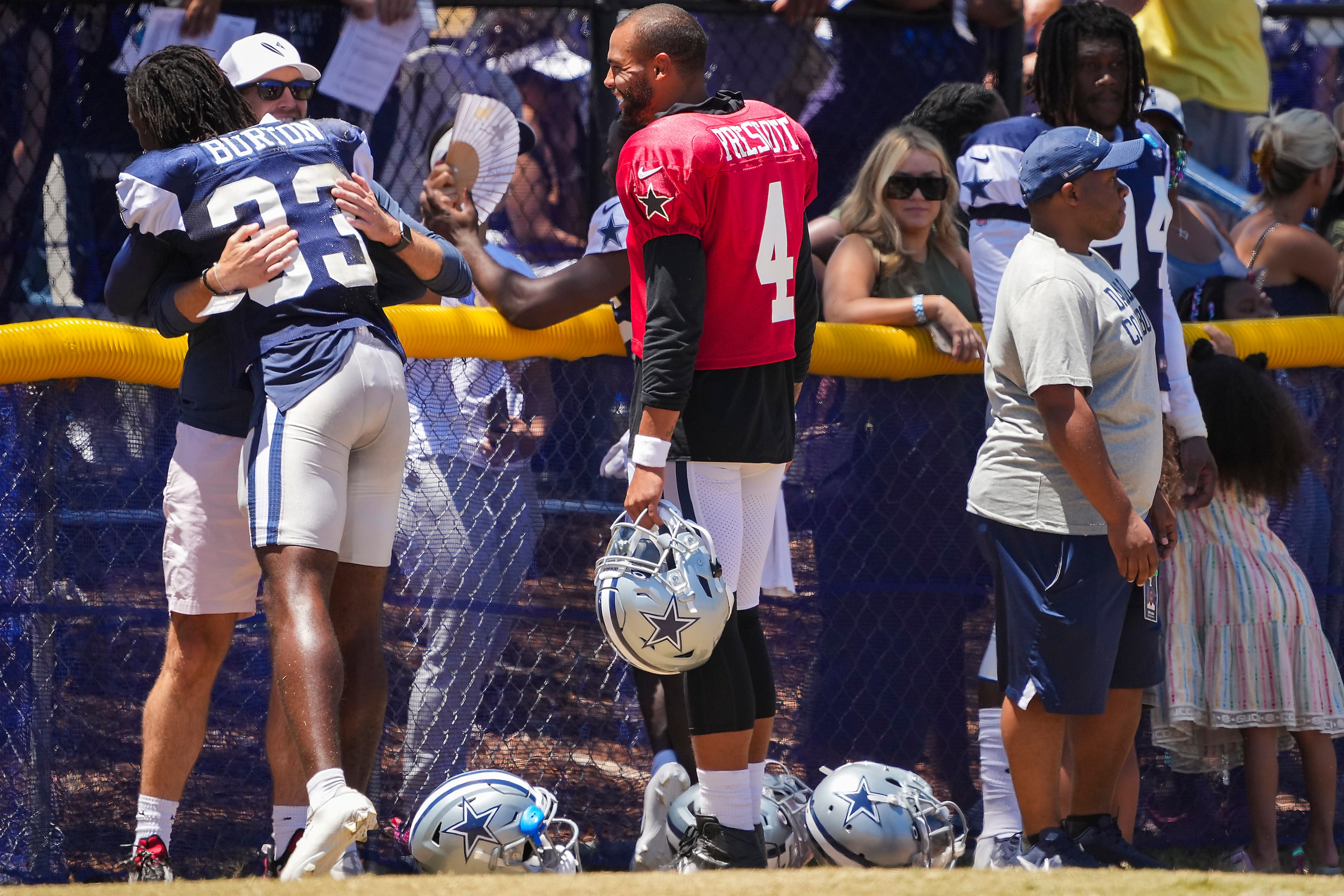 Dallas Cowboys quarterback Dak Prescott (4), cornerback Deante Burton (33) and defensive end...