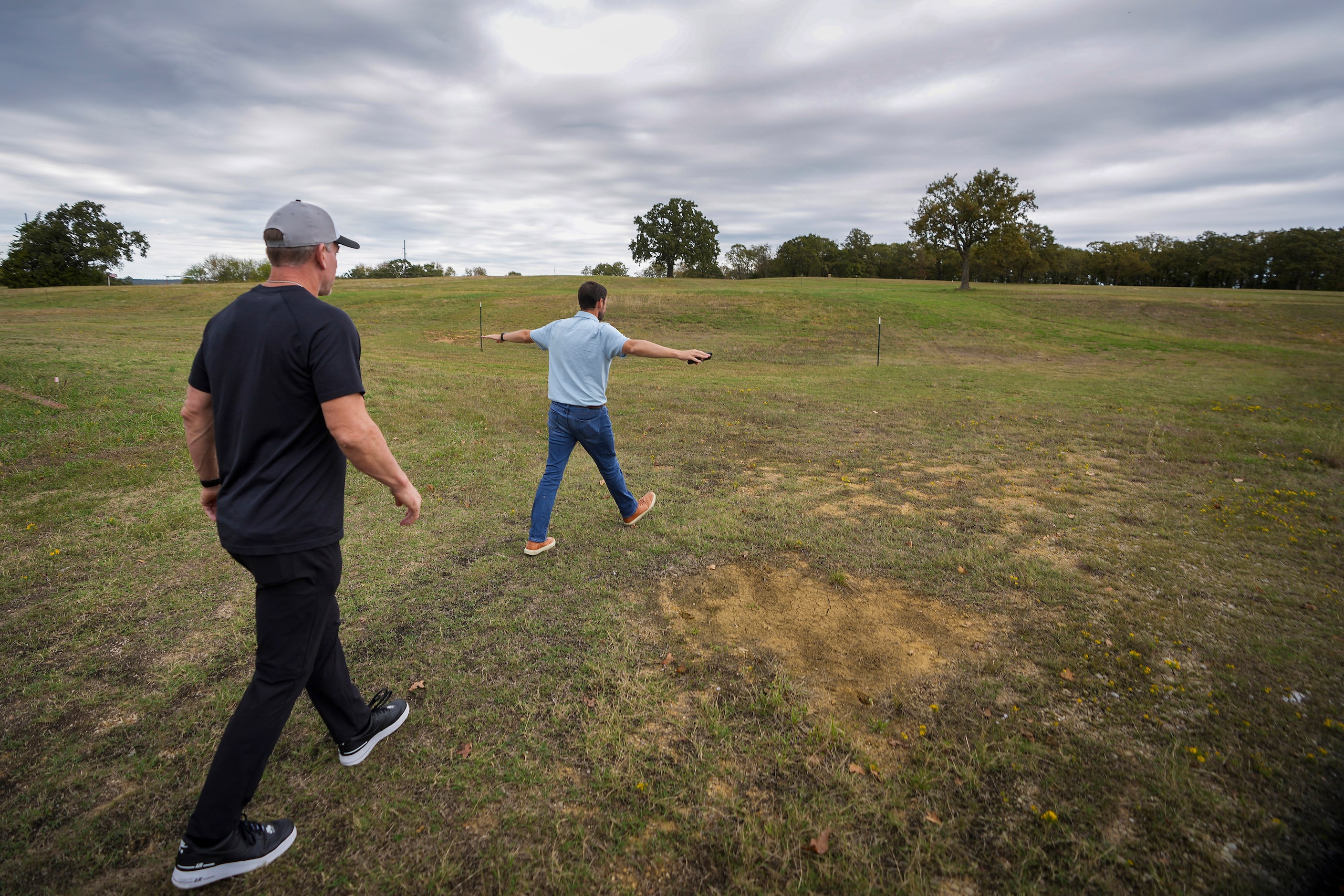 Troy Aikman tours the site in Nichols Park where a music festival is planned with Emmett...