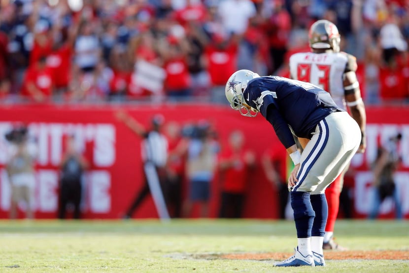 Dallas Cowboys quarterback Matt Cassel (16) stands dejected after throwing an interception...