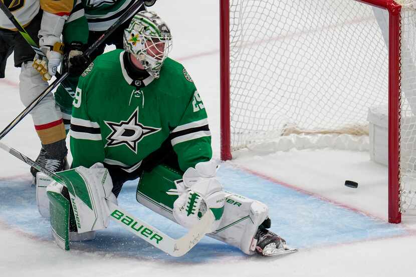 The puck is seen in the net of Dallas Stars goaltender Jake Oettinger on a goal by Vegas...
