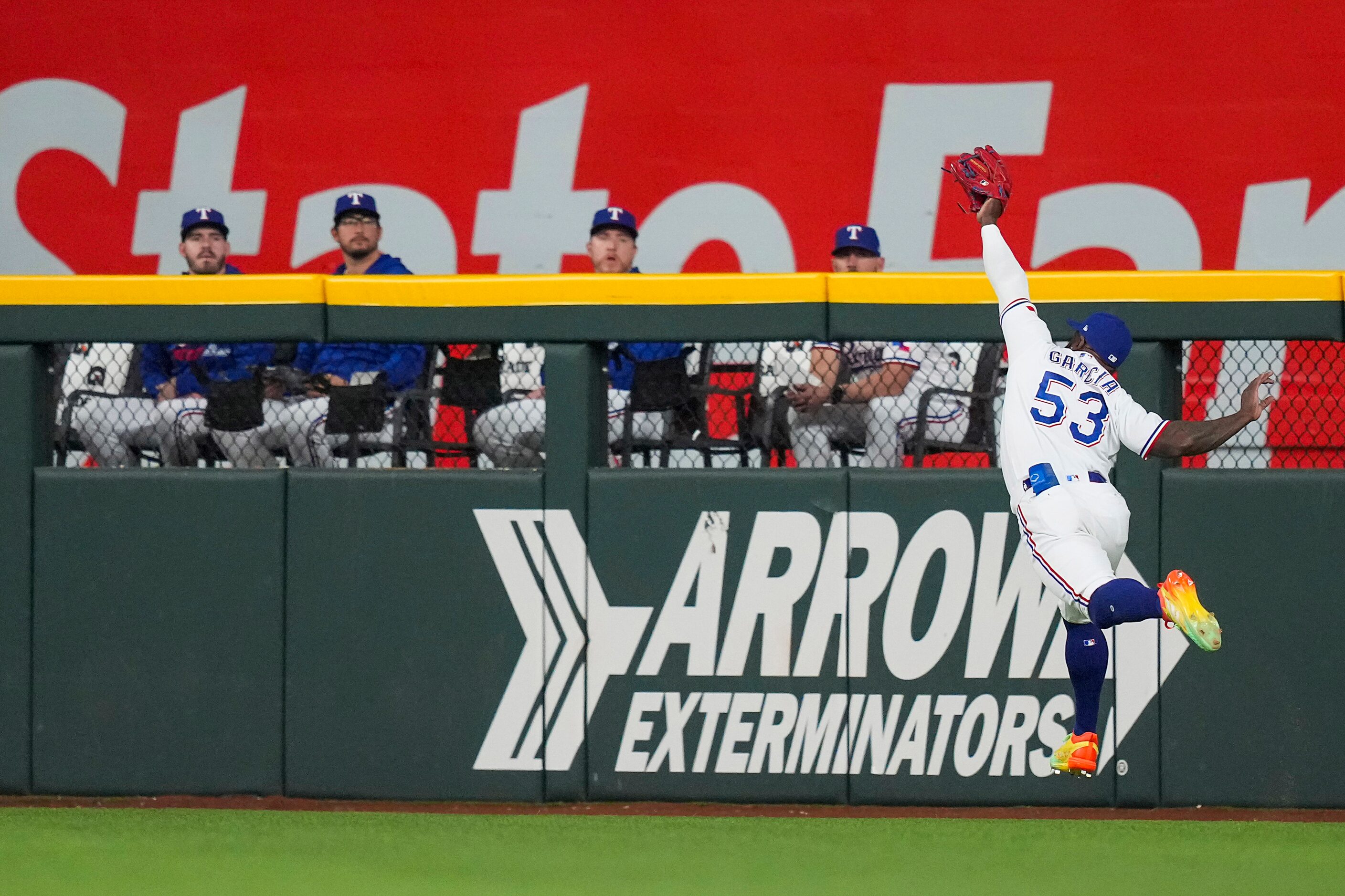 Texas Rangers right fielder Adolis Garcia makes a leaping catch on a line drive by Houston...