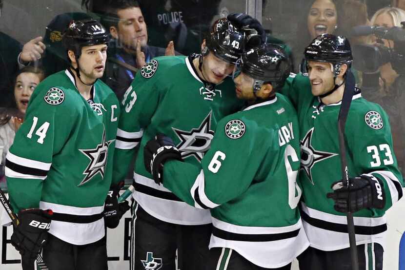 Dallas Stars right wing Valeri Nichushkin (43) is congratulated by teammates (from left)...