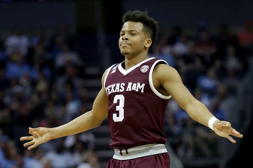 CHARLOTTE, NC - MARCH 18:  Admon Gilder #3 of the Texas A&M Aggies reacts after a three...