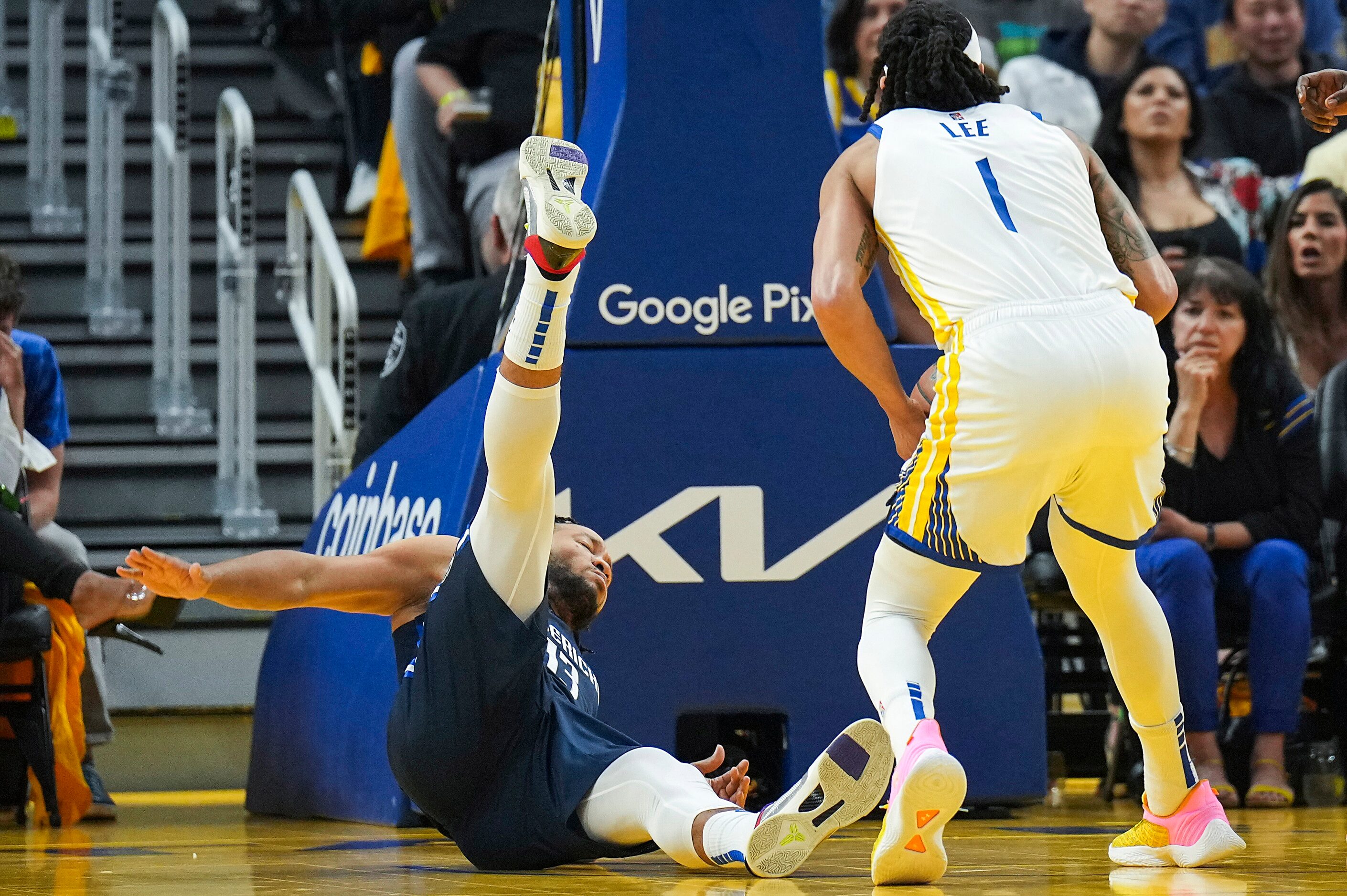 Dallas Mavericks guard Jalen Brunson (13) is knocked backwards on an offensive foul by...