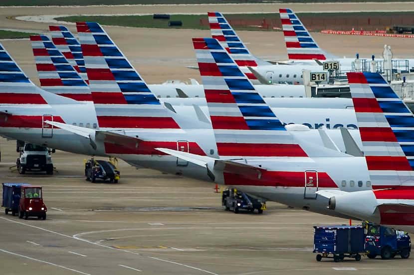 American Airlines and American Eagle planes parked at their gates at DFW International...