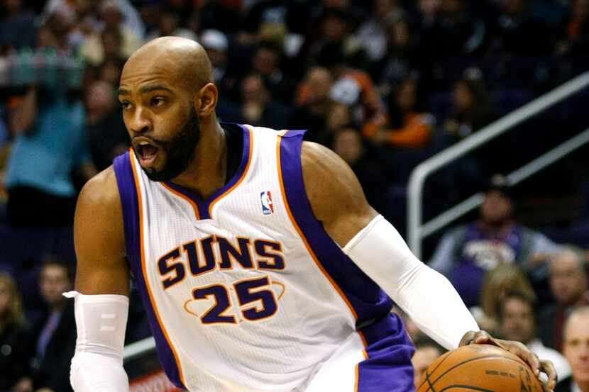 Phoenix Suns guard Vince Carter drives against the Philadelphia 76ers during the fourth...