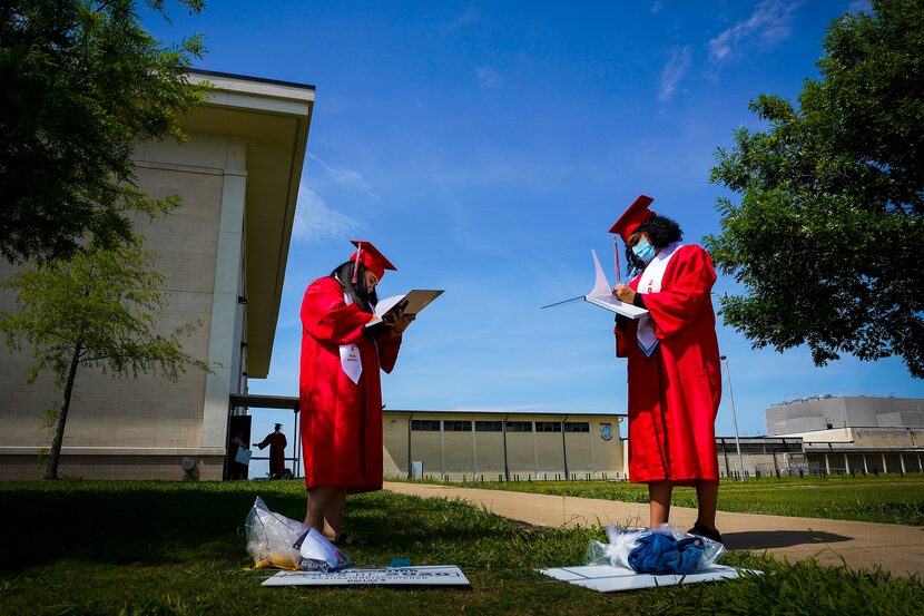 Seniors Andrea Soto (left) and Samanta Zuniga signed each other's yearbooks after picking up...