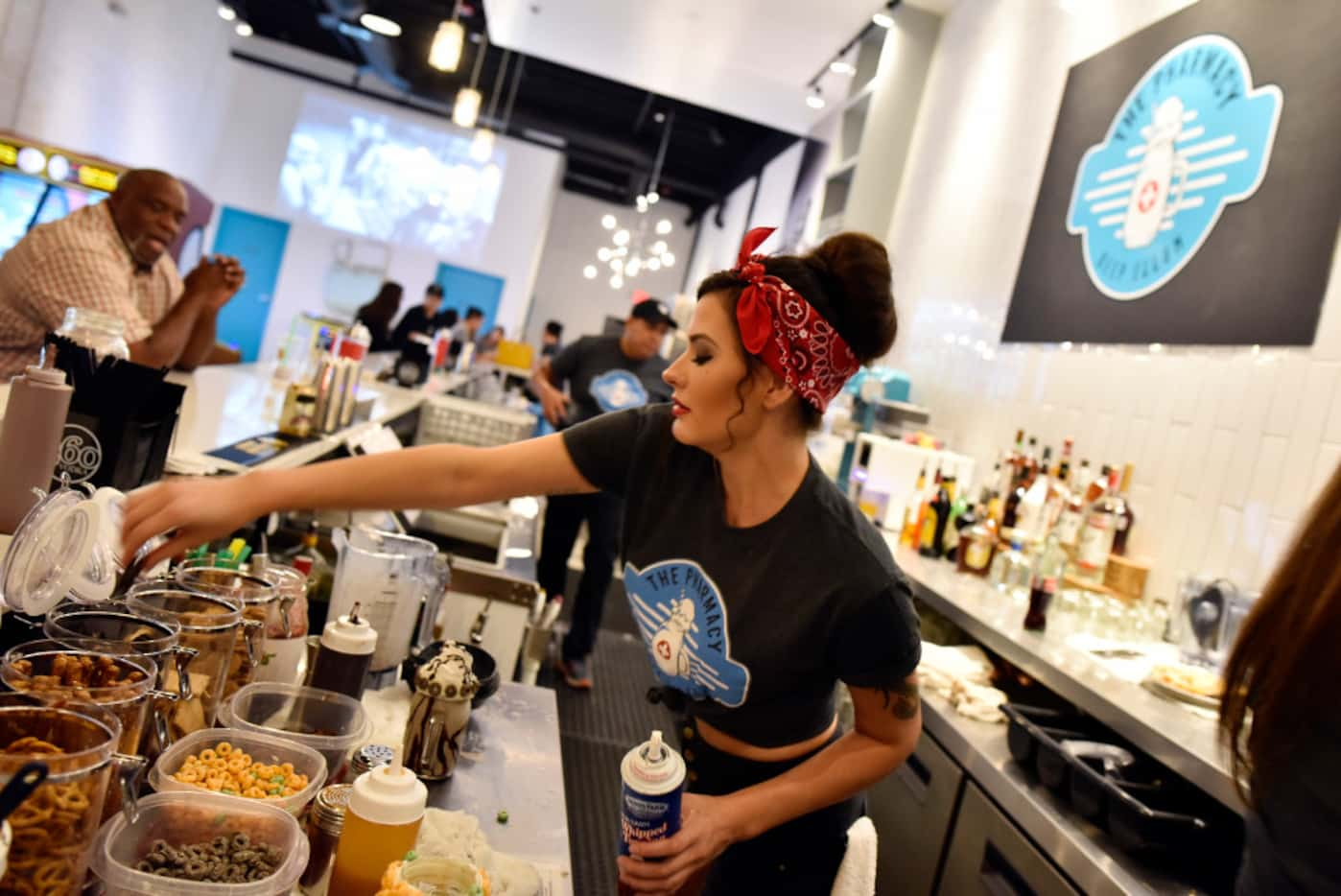 Bartender Erin Bush prepares milkshakes at Deep Ellum's newest bar The Pharmacy, Saturday,...