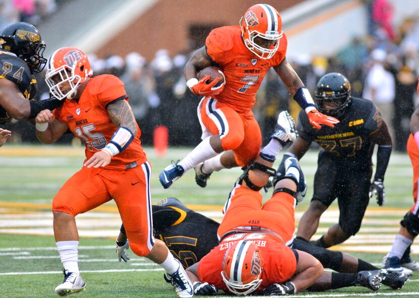 Oct 31, 2015; Hattiesburg, MS, USA; UTEP Miners running back LaQuintus Dowell (7) jumps over...