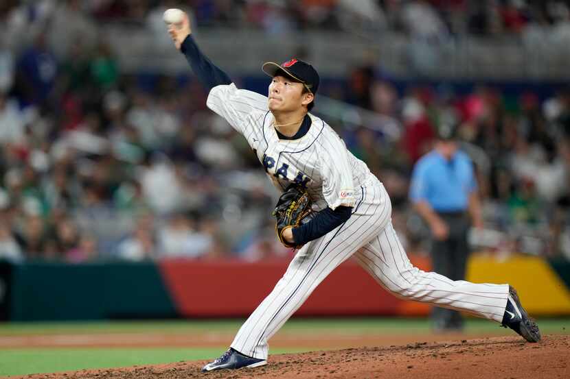 FILE - Japan's Yoshinobu Yamamoto delivers a pitch during the fifth inning of a World...