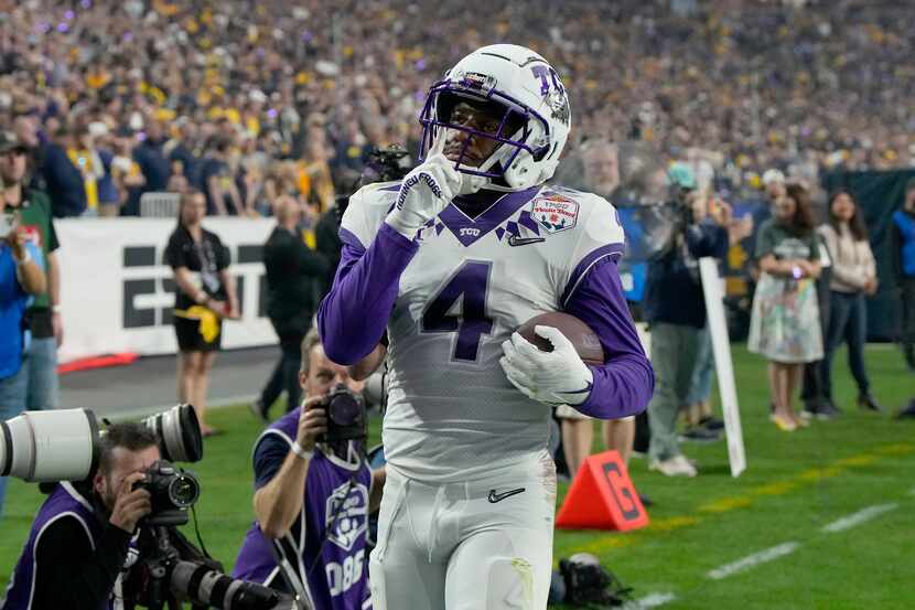 TCU wide receiver Taye Barber (4) celebrates his touchdown against Michigan during the first...