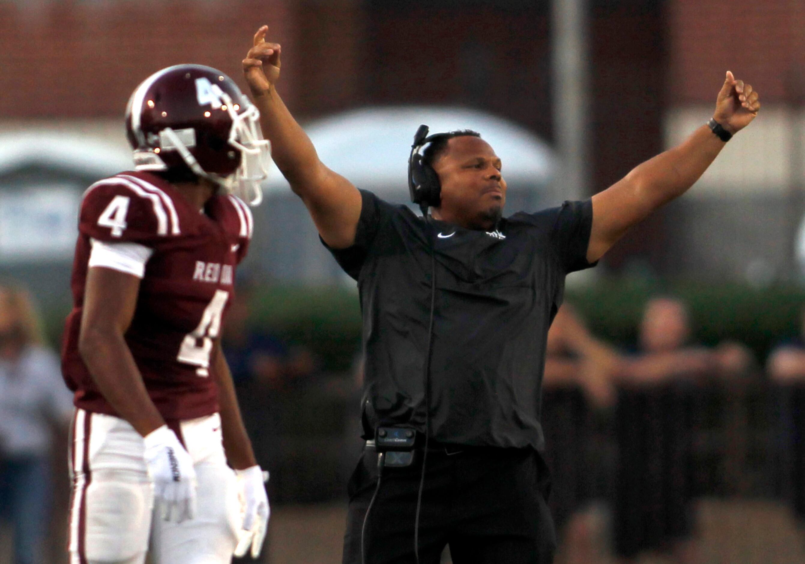 Red Oak head coach Tony Holmes reacts to a defensive stop during first half action against...