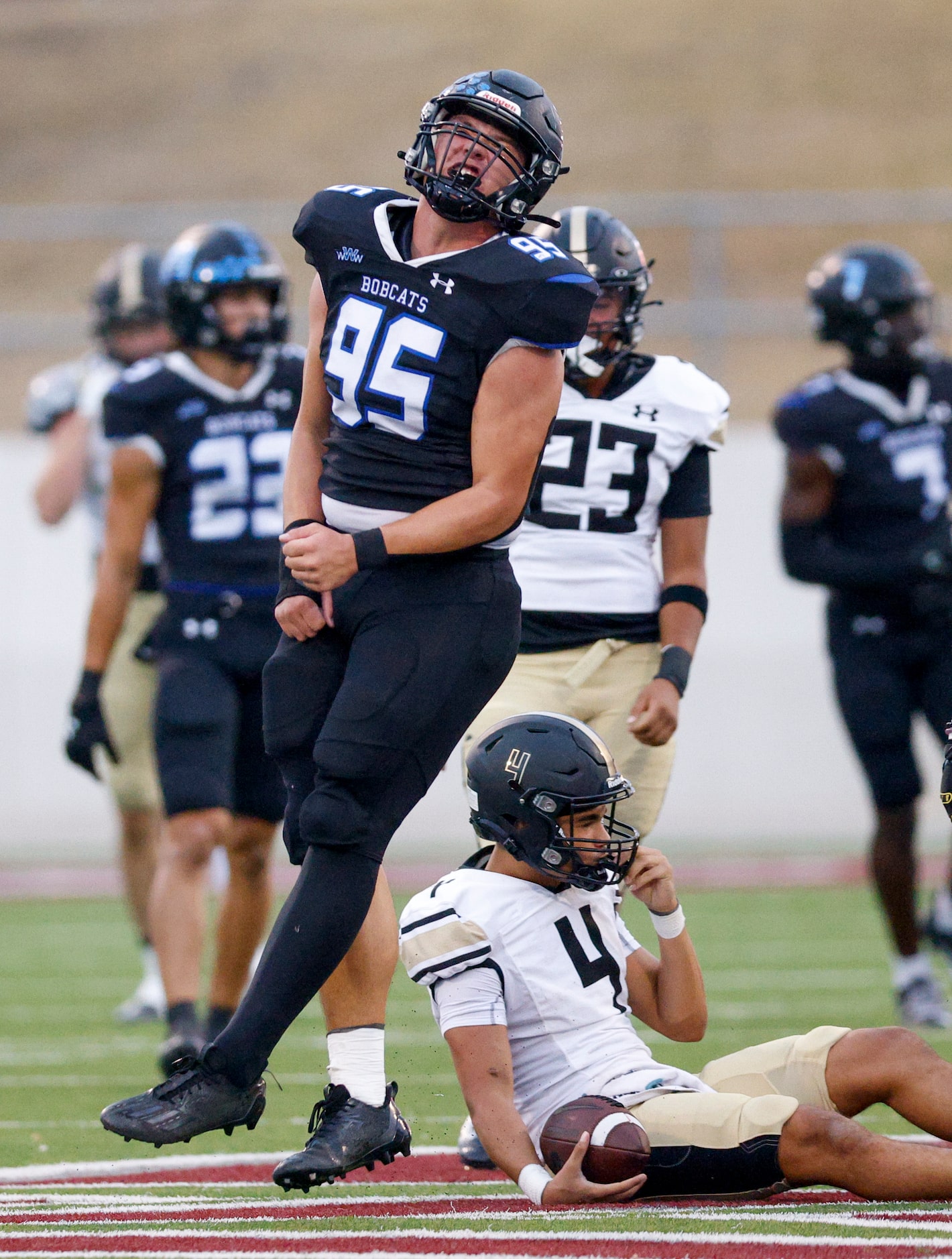 Trophy Club Byron Nelson’s Braedon Ulrich (95) flexes after sacking Keller Fossil Ridge...