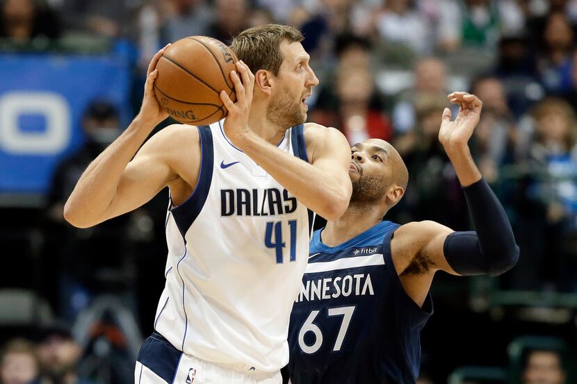 Dallas Mavericks forward Dirk Nowitzki (41), of Germany, looks for an opening to the basket...