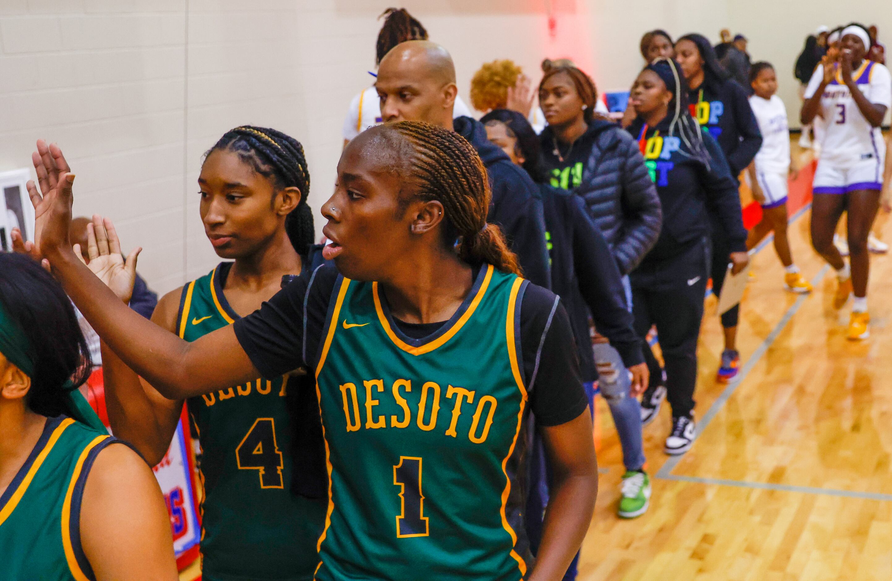 DeSoto girls basketball players line up to shake hands with Montverde Academy after DeSoto’s...