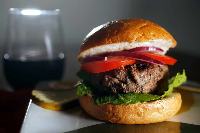 A grass-fed beef burger during a wine panel at Tina Danze's home in Dallas on Monday,...