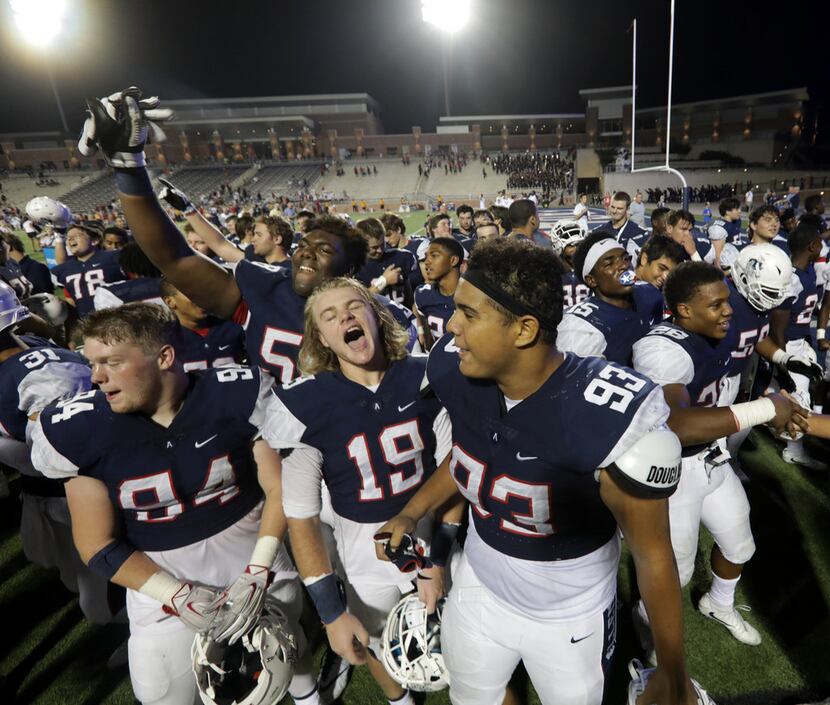 Allen High School football players celebrate a win over Coppell High School at Eagle Stadium...